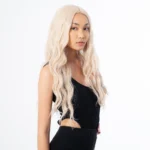 model wearing ixora hair kim bleach blonde wig