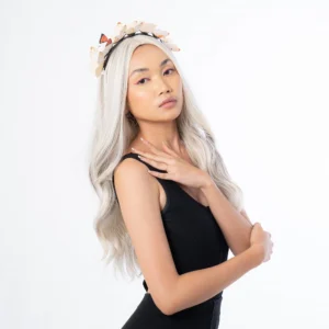 a girl went viral wearing platinum blonde wig on tiktok with white butterfly headband